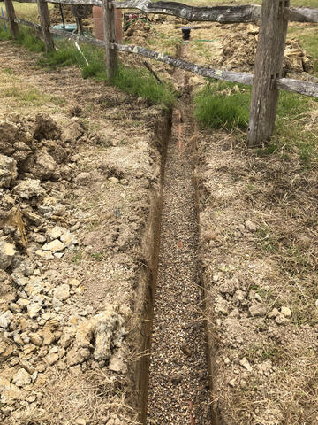 110mm drainage pipe in trench underneath fencing